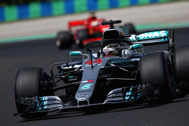 BUDAPEST, HUNGARY - JULY 28:  Lewis Hamilton of Great Britain driving the (44) Mercedes AMG Petronas F1 Team Mercedes WO9 leads Sebastian Vettel of Germany driving the (5) Scuderia Ferrari SF71H on track during final practice for the Formula One Grand Prix of Hungary at Hungaroring on July 28, 2018 in Budapest, Hungary.  (Photo by Charles Coates/Getty Images)