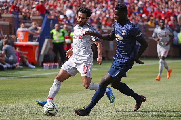 ANN ARBOR, MI - JULY 28: Mohamed Salah #11 of Liverpool and Axel Tuanzebe compete for possession during the International Champions Cup 2018 match at Michigan Stadium on July 28, 2018 in Ann Arbor, Michigan. (Photo by Gregory Shamus/International Champions Cup/Getty Images) ANN ARBOR, MI - JULY 28: Mohamed Salah #11 of Liverpool and Axel Tuanzebe compete for possession during the International Champions Cup 2018 match at Michigan Stadium on July 28, 2018 in Ann Arbor, Michigan. (Photo by Gregory Shamus/International Champions Cup/Getty Images)
