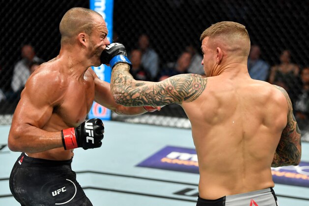 CALGARY, AB - JULY 28:  (R-L) Dustin Poirier punches Eddie Alvarez in their lightweight bout during the UFC Fight Night event at Scotiabank Saddledome on July 28, 2018 in Calgary, Alberta, Canada. (Photo by Jeff Bottari/Zuffa LLC/Zuffa LLC via Getty Images)