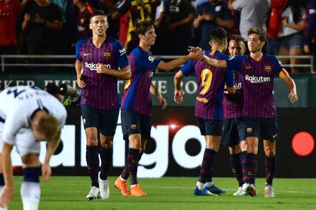 Barcelona's players celebrate with Arthur (R) after he scored the second goal in the first half against Tottenham Hotspur during the International Champions Cup football match between Barcelona and Tottenham Hotspur on July 28, 2018 in Pasadena, California. (Photo by Frederic J. BROWN / AFP)        (Photo credit should read FREDERIC J. BROWN/AFP/Getty Images)