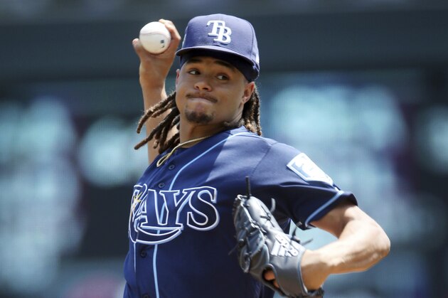 Tampa Bay Rays pitcher Chris Archer throws against the Minnesota Twins in the first inning of a baseball game Saturday, July 14, 2018, in Minneapolis. (AP Photo/Jim Mone)