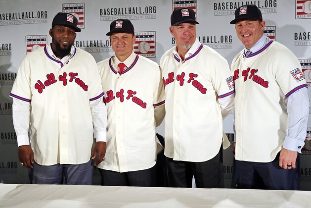 FILE - In this Jan. 25, 2018, file photo, Baseball Hall of Fame inductees, from left, Vladimir Guerrero, Trevor Hoffman, Chipper Jones and Jim Thome, pose during a news conference in New York. Induction ceremonies will be Sunday, July 29, 2018. (AP Photo/Frank Franklin II, File)