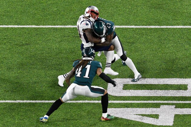MINNEAPOLIS, MN - FEBRUARY 04:  Malcolm Jenkins #27 of the Philadelphia Eagles tackles Brandin Cooks #14 of the New England Patriots during the second quarter in Super Bowl LII at U.S. Bank Stadium on February 4, 2018 in Minneapolis, Minnesota.  (Photo by Hannah Foslien/Getty Images)