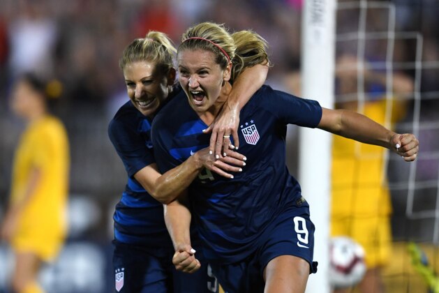 USA's Lindsey Horan (R) celebrates after scoring the tying goal and is hugged by USA's McCall Zerboni during the 2018 Tournament of Nations at Pratt & Whitney Stadium at Rentschler Field on July 29, 2018 in East Hartford, Connecticut. (Photo by TIMOTHY A. CLARY / AFP)        (Photo credit should read TIMOTHY A. CLARY/AFP/Getty Images)