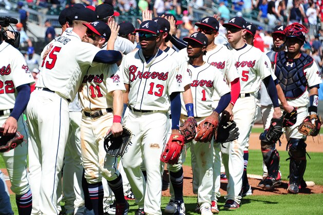 ATLANTA, GA - JULY 29: Sean Newcomb #15 of the Atlanta Braves is congratulated by Ender Inciarte #11 as teammates line up to greet Newcomb after throwing a one-hit game through 8 2/3 innings against the Los Angeles Dodgers at SunTrust Park on July 29, 2018 in Atlanta, Georgia. (Photo by Scott Cunningham/Getty Images)