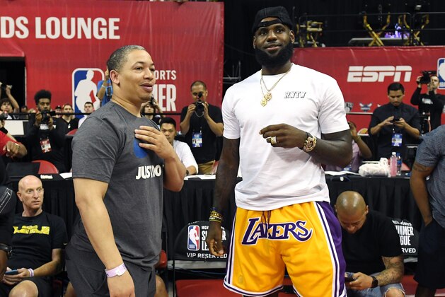 LAS VEGAS, NV - JULY 15:  Head coach Tyronn Lue (L) of the Cleveland Cavaliers talks with LeBron James of the Los Angeles Lakers after a quarterfinal game of the 2018 NBA Summer League between the Lakers and the Detroit Pistons at the Thomas & Mack Center on July 15, 2018 in Las Vegas, Nevada. NOTE TO USER: User expressly acknowledges and agrees that, by downloading and or using this photograph, User is consenting to the terms and conditions of the Getty Images License Agreement.  (Photo by Ethan Miller/Getty Images)