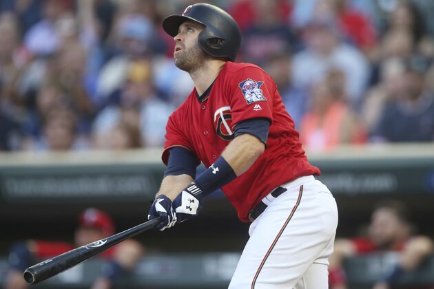 Minnesota Twins' Brian Dozier bats against the Tampa Bay Rays in the first inning of a baseball game Friday, July 13, 2018, in Minneapolis. (AP Photo/Jim Mone)