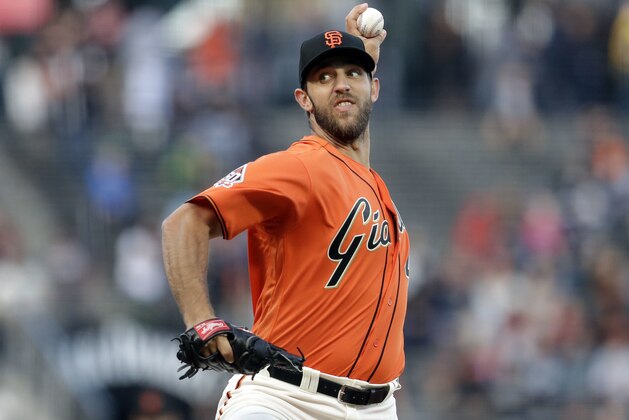 San Francisco Giants starting pitcher Madison Bumgarner throws to an Oakland Athletics during the first inning of a baseball game Friday, July 13, 2018, in San Francisco. (AP Photo/Marcio Jose Sanchez)