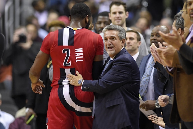 Washington Wizards team owner Ted Lenses, right, reacts with Washington Wizards guard John Wall (2) after Wall come out of the game during the second half of an NBA basketball game against the Boston Celtics, Tuesday, Jan. 24, 2017, in Washington. The Wizards won 123-108. (AP Photo/Nick Wass)
