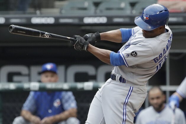 Toronto Blue Jays' Curtis Granderson hits a single against the Chicago White Sox during the first inning of a baseball game Saturday, July 28, 2018, in Chicago. (AP Photo/Nam Y. Huh)