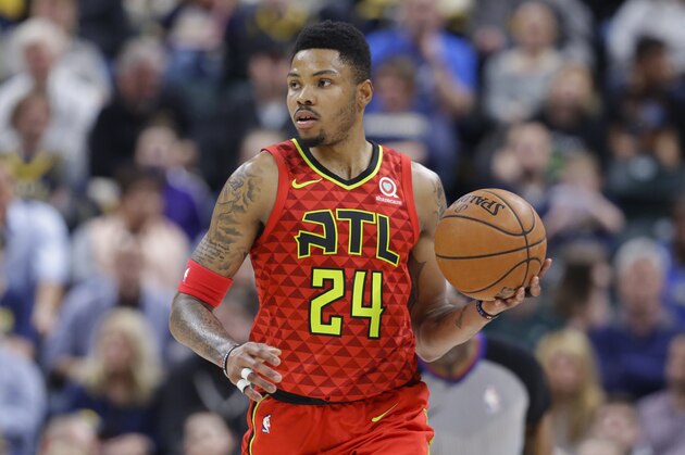 Atlanta Hawks guard Kent Bazemore (24) plays against the Indiana Pacers during the second half of an NBA basketball game in Indianapolis, Friday, Feb. 23, 2018. The Pacers defeated the Hawks 116-93. (AP Photo/Michael Conroy)