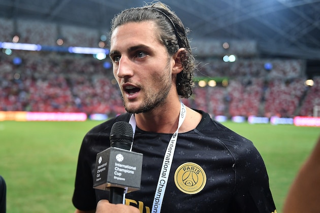 SINGAPORE - JULY 30: Adrien Rabiot #25 of Paris Saint Germain interviews during the International Champions Cup match between Paris Saint Germain and Clu b de Atletico Madrid at the National Stadium on July 30, 2018 in Singapore.  (Photo by Thananuwat Srirasant/Getty Images for ICC)