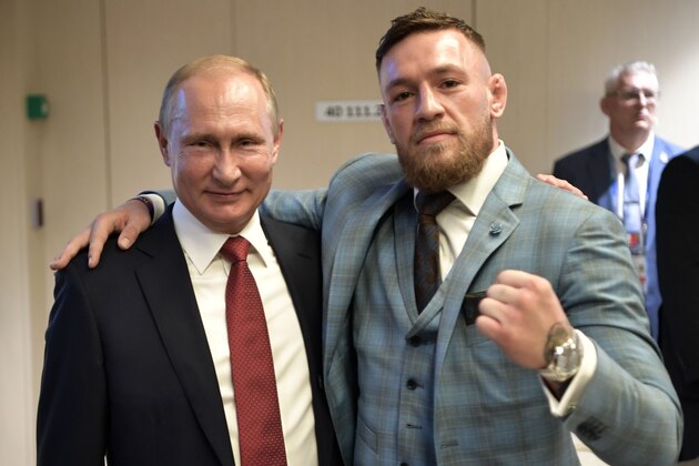 Russian President Vladimir Putin (L) and Irish Mixed Martial Arts fighter Conor McGregor pose after the first half of the Russia 2018 World Cup final football match between France and Croatia at the Luzhniki Stadium in Moscow on July 15, 2018. (Photo by Alexey NIKOLSKY / SPUTNIK / AFP) / RESTRICTED TO EDITORIAL USE - NO MOBILE PUSH ALERTS/DOWNLOADS        (Photo credit should read ALEXEY NIKOLSKY/AFP/Getty Images)