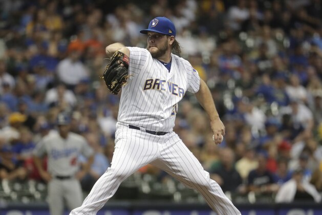 Milwaukee Brewers starting pitcher Wade Miley throws during the first inning of a baseball game against the Los Angeles Dodgers Friday, July 20, 2018, in Milwaukee. (AP Photo/Morry Gash)
