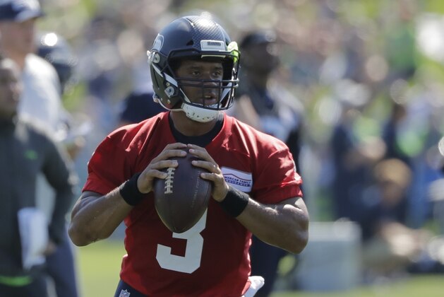 Seattle Seahawks quarterback Russell Wilson passes during NFL football training camp, Thursday, July 26, 2018, in Renton, Wash. (AP Photo/Ted S. Warren)