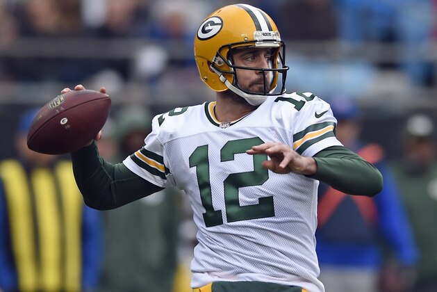 FILE - In this Dec. 17, 2017, file photo, Green Bay Packers' Aaron Rodgers looks to pass against the Carolina Panthers during the first half of an NFL football game in Charlotte, N.C. The Green Bay Packers opened on-field work in their offseason program this week, an especially important time for a team that has had a lot of changes since the end of a 7-9 season. On offense, Aaron Rodgers is healthy again after missing much of last season with a broken collarbone.. (AP Photo/Mike McCarn, File)
