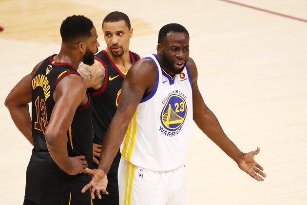 CLEVELAND, OH - JUNE 06:  Draymond Green #23 of the Golden State Warriors reacts as Tristan Thompson #13 and George Hill #3 of the Cleveland Cavaliers look on during Game Three of the 2018 NBA Finals at Quicken Loans Arena on June 6, 2018 in Cleveland, Ohio. NOTE TO USER: User expressly acknowledges and agrees that, by downloading and or using this photograph, User is consenting to the terms and conditions of the Getty Images License Agreement.  (Photo by Gregory Shamus/Getty Images)