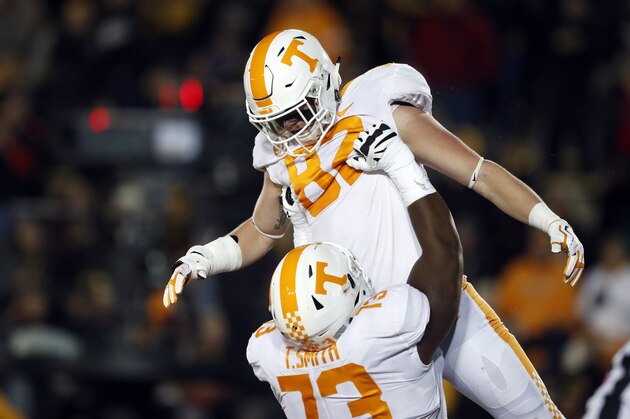 FILE - In this Nov. 11, 2017, file photo, Tennessee tight end Ethan Wolf, top, is congratulated by Trey Smith after catching a touchdown pass during the first half of an NCAA college football game against Missouri in Columbia, Mo. Wolf was one of the Tennessee seniors who arrived on campus three years ago amid expectations that they would lead the program back to Southeastern Conference title contention. It didn't quite work out that way. Only a fraction of that class remains as those seniors prepare to close their careers, and the coach who recruited them has been fired. (AP Photo/Jeff Roberson, File)