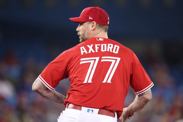 TORONTO, ON - JULY 1: John Axford #77 of the Toronto Blue Jays delivers a pitch in the seventh inning during MLB game action against the Detroit Tigers at Rogers Centre on July 1, 2018 in Toronto, Canada. (Photo by Tom Szczerbowski/Getty Images)