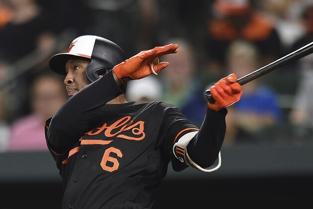 Baltimore Orioles' Jonathan Schoop follows through on a solo home run against the Tampa Bay Rays in the fifth inning of a baseball game, Friday, July 27, 2018, in Baltimore. (AP Photo/Gail Burton)