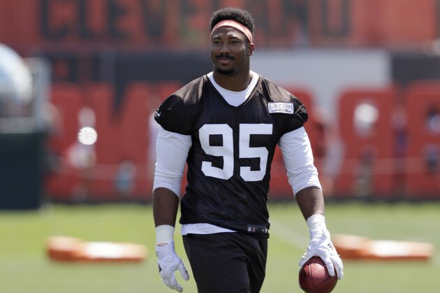 Cleveland Browns defensive end Myles Garrett walks on the field at the NFL football team's training camp facility, Thursday, July 26, 2018, in Berea, Ohio. (AP Photo/Tony Dejak)