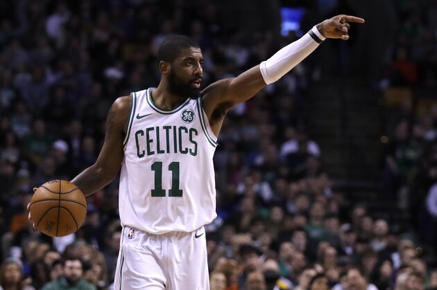 Boston Celtics guard Kyrie Irving (11) calls to teammates during the first quarter of an NBA basketball game in Boston, Wednesday, Feb. 28, 2018. (AP Photo/Charles Krupa)