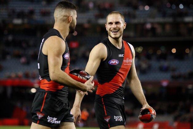 MELBOURNE, AUSTRALIA - JULY 27: David Zaharakis of the Bombers (right) celebrates with Adam Saad of the Bombers during the 2018 AFL round 19 match between the Essendon Bombers and the Sydney Swans at Etihad Stadium on July 27, 2018 in Melbourne, Australia. (Photo by Adam Trafford/AFL Media/Getty Images)
