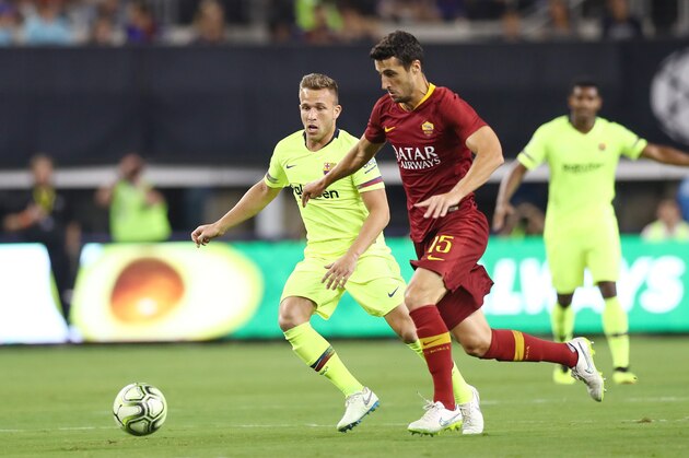 ARLINGTON, TX - JULY 31:   Ivan Marcano #15 of AS Roma and Arthur Melo #4 of FC Barcelona vie for posession during their International Champions Cup 2018 match at AT&T Stadium on July 31, 2018 in Arlington, Texas.  (Photo by Ronald Martinez/International Champions Cup/Getty Images)