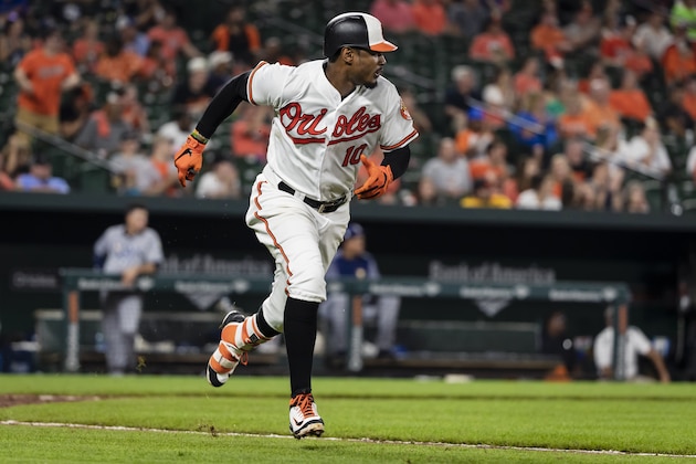 BALTIMORE, MD - JULY 26: Adam Jones #10 of the Baltimore Orioles singles against the Tampa Bay Rays during the seventh inning at Oriole Park at Camden Yards on July 26, 2018 in Baltimore, Maryland. (Photo by Scott Taetsch/Getty Images)