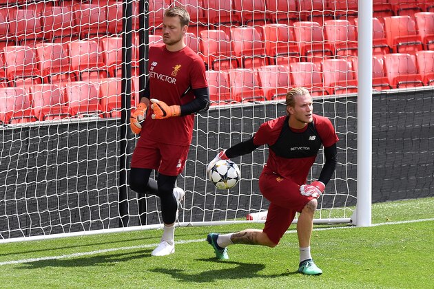 Liverpool's Belgian goalkeeper Simon Mignolet (L) and Liverpool's German goalkeeper Loris Karius attends a training session and media day at Anfield stadium in Liverpool, north west England on May 21, 2018, ahead of their UEFA Champions League final football match against Real Madrid in Kiev on May 26. (Photo by Paul ELLIS / AFP)        (Photo credit should read PAUL ELLIS/AFP/Getty Images)