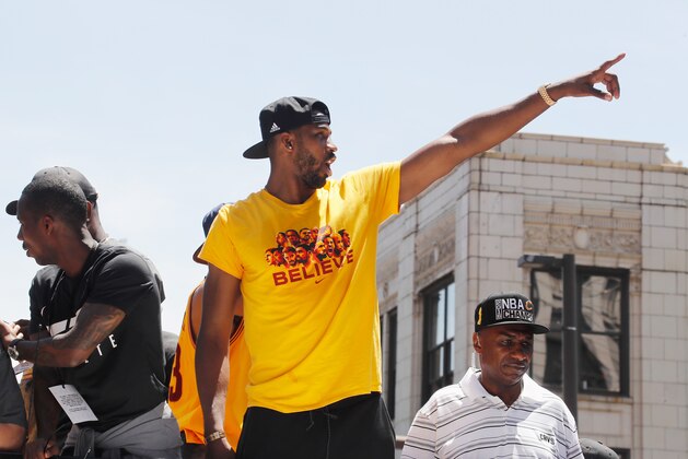 CLEVELAND, OH - JUNE 22:  Tristan Thompson #13 of the Cleveland Cavaliers waves at fans during the Cleveland Cavaliers Victory Parade And Rally on June 22, 2016 in downtown Cleveland, Ohio.  NOTE TO USER: User expressly acknowledges and agrees that, by downloading and/or using this Photograph, user is consenting to the terms and conditions of the Getty Images License Agreement. Mandatory Copyright Notice: Copyright 2016 NBAE  (Photo by Gregory Shamus/NBAE/Getty Images)