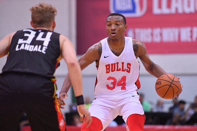 LAS VEGAS, NV - JULY 10:  Wendell Carter Jr. #34 of the Chicago Bulls dribbles against Jock Landale #34 of the Atlanta Hawks during the 2018 NBA Summer League at the Cox Pavilion on July 10, 2018 in Las Vegas, Nevada. NOTE TO USER: User expressly acknowledges and agrees that, by downloading and or using this photograph, User is consenting to the terms and conditions of the Getty Images License Agreement.  (Photo by Sam Wasson/Getty Images)