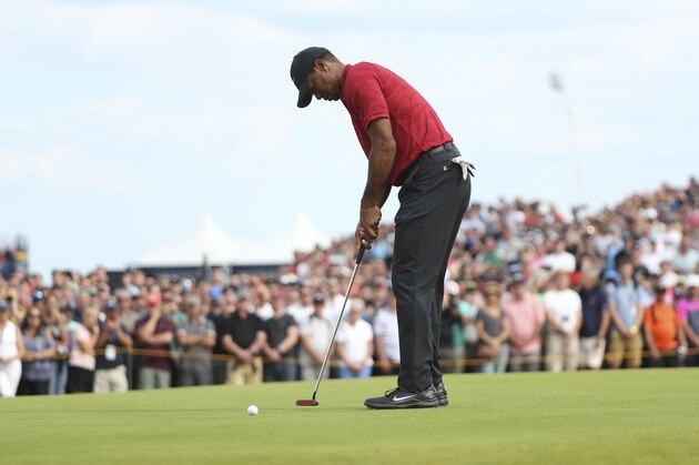 Tiger Woods of the US putts on the 8th green during the final round of the British Open Golf Championship in Carnoustie, Scotland, Sunday July 22, 2018. (AP Photo/Peter Morrison)