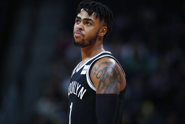 Brooklyn Nets guard D'Angelo Russell reacts as he heads to the bench while facing the Denver Nuggets in the first half of an NBA basketball game Tuesday, Nov. 7, 2017, in Denver. (AP Photo/David Zalubowski)