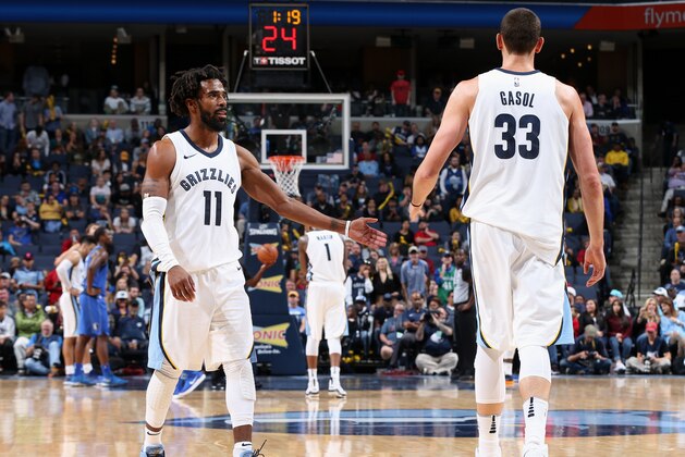MEMPHIS, TN - OCTOBER 26:  Marc Gasol #33 and Mike Conley #11 of the Memphis Grizzlies high five during the game against the Dallas Mavericks on October 26, 2017 at FedExForum in Memphis, Tennessee. NOTE TO USER: User expressly acknowledges and agrees that, by downloading and or using this photograph, User is consenting to the terms and conditions of the Getty Images License Agreement. Mandatory Copyright Notice: Copyright 2017 NBAE (Photo by Joe Murphy/NBAE via Getty Images)
