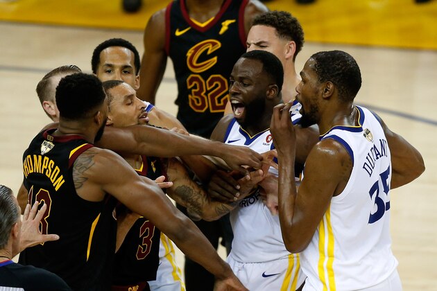 OAKLAND, CA - MAY 31:  Tristan Thompson #13 of the Cleveland Cavaliers and Draymond Green #23 of the Golden State Warriors exchange words in overtime during Game 1 of the 2018 NBA Finals at ORACLE Arena on May 31, 2018 in Oakland, California. NOTE TO USER: User expressly acknowledges and agrees that, by downloading and or using this photograph, User is consenting to the terms and conditions of the Getty Images License Agreement.  (Photo by Lachlan Cunningham/Getty Images)