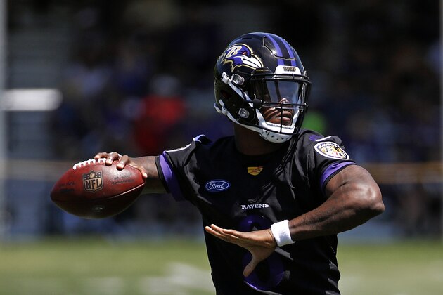 Baltimore Ravens quarterback Lamar Jackson throws a pass during an NFL football training camp practice at the team's headquarters in Owings Mills, Md., Thursday, July 19, 2018. (AP Photo/Patrick Semansky)