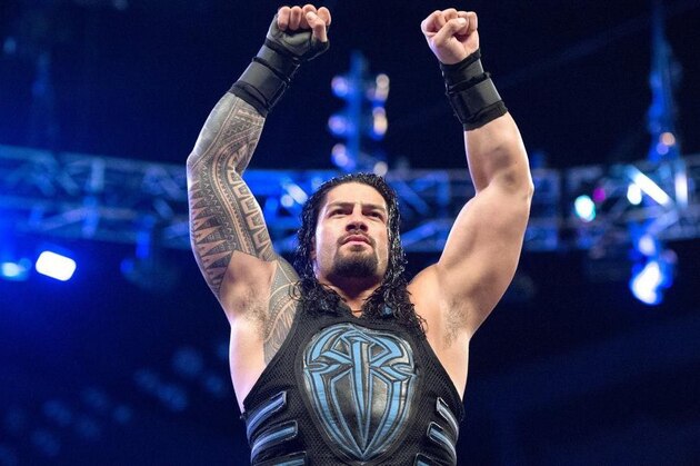 Roman Reigns posing for the crowd.