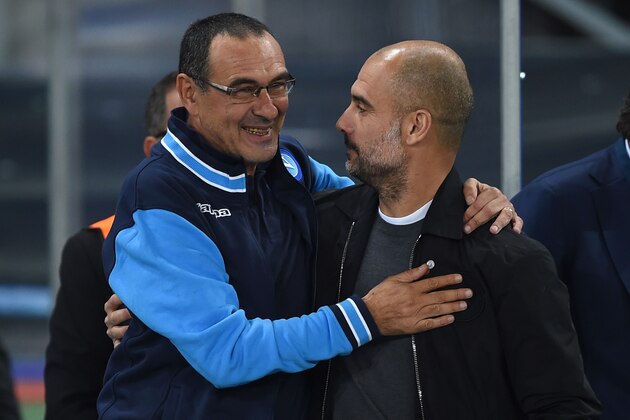 Manchester City's Spanish manager Pep Guardiola (R) greets Napoli's coach from Italy Maurizio Sarri before the UEFA Champions League football match Napoli vs Manchester City on November 1, 2017 at the San Paolo stadium in Naples. Manchester City won 2-4. / AFP PHOTO / Filippo MONTEFORTE        (Photo credit should read FILIPPO MONTEFORTE/AFP/Getty Images)