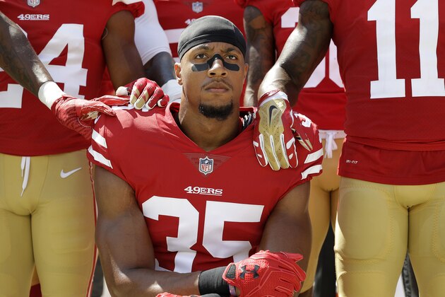 San Francisco 49ers safety Eric Reid (35) kneels in front of teammates during the playing of the national anthem before an NFL football game between the 49ers and the Carolina Panthers in Santa Clara, Calif., Sunday, Sept. 10, 2017. (AP Photo/Marcio Jose Sanchez)