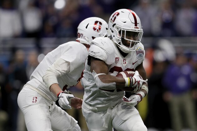SAN ANTONIO, TX - DECEMBER 28: K.J. Costello #3 of the Stanford Cardinal hands off to Bryce Love #20 in the second half of the Valero Alamo Bowl at Alamodome against the TCU Horned Frogs on December 28, 2017 in San Antonio, Texas. (Photo by Tim Warner/Getty Images)