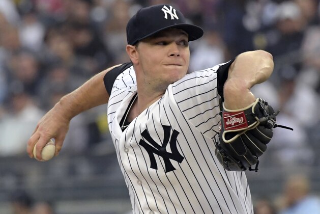 New York Yankees starting pitcher Sonny Gray winds up during the first inning of the team's baseball game against the Washington Nationals on Wednesday, June 13, 2018, at Yankee Stadium in New York. (AP Photo/Bill Kostroun)