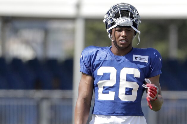New York Giants running back Saquon Barkley works out during NFL football training camp, Wednesday, Aug. 1, 2018, in East Rutherford, N.J. (AP Photo/Julio Cortez)