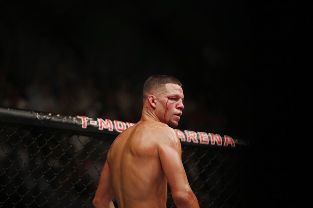 Conor McGregor fights Nate Diaz during their welterweight mixed martial arts bout at UFC 202 on Saturday, Aug. 20, 2016, in Las Vegas. McGregor won by split decision. (AP Photo/Isaac Brekken)