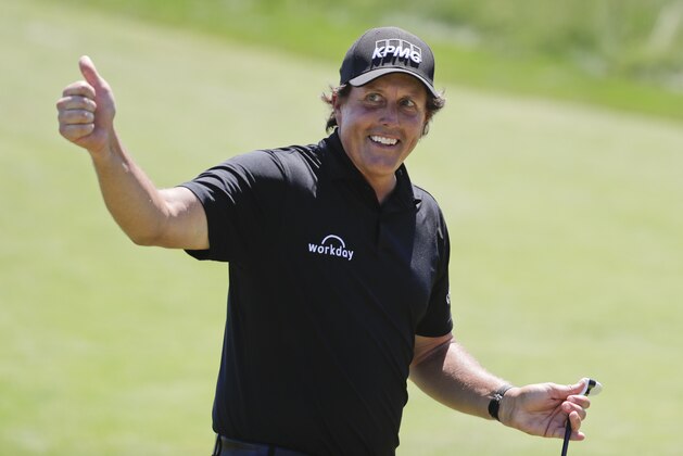 Phil Mickelson reacts after sinking a putt on the 13th hole during the final round of the U.S. Open Golf Championship, Sunday, June 17, 2018, in Southampton, N.Y. (AP Photo/Frank Franklin II)
