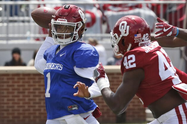 Oklahoma quarterback Kyler Murray (1) passes under pressure from Mark Jackson, Jr. (42) during the Oklahoma NCAA college football spring intrasquad game in Norman, Okla., Saturday, April 14, 2018. (AP Photo/Sue Ogrocki)