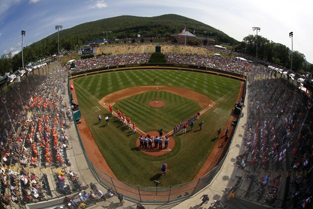 Japan and Texas line the baselines at Lamade Stadium during introductions before the Little League World Series Championship baseball game in South Williamsport, Pa., Sunday, Aug. 27, 2017. (AP Photo/Gene J. Puskar).