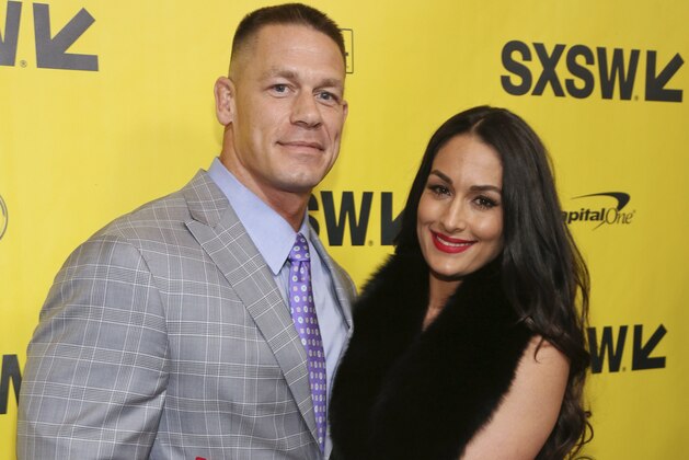 John Cena and his fiancee, Nikki Bella, arrive for the world premiere of