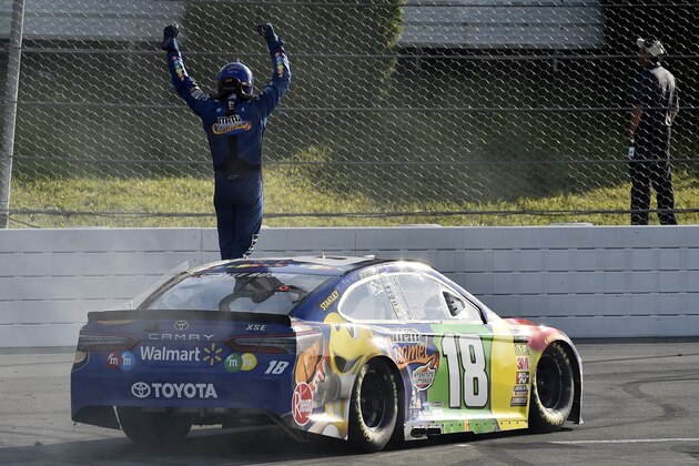 Kyle Busch celebrates after winning a NASCAR Cup Series auto race, Sunday, July 29, 2018, in Long Pond, Pa. (AP Photo/Derik Hamilton)