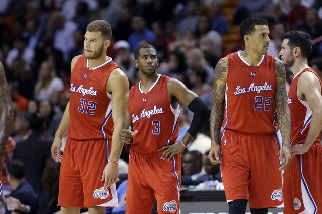 Los Angeles Clippers forward Blake Griffin (32) , guard Chris Paul (3) ,forward Matt Barnes (22) and guard J.J. Redick, right, stand on the court in the second half of an NBA basketball game against the Miami Heat, Thursday, Nov. 20, 2014, in Miami. The Clippers defeated the Heat 110-93. (AP Photo/Lynne Sladky)